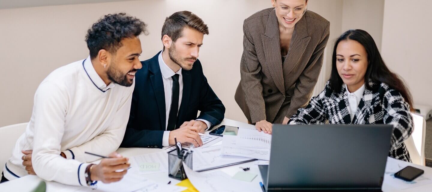 Contractors and small business professionals in a client meeting, showing who may need public liability insurance in the UK