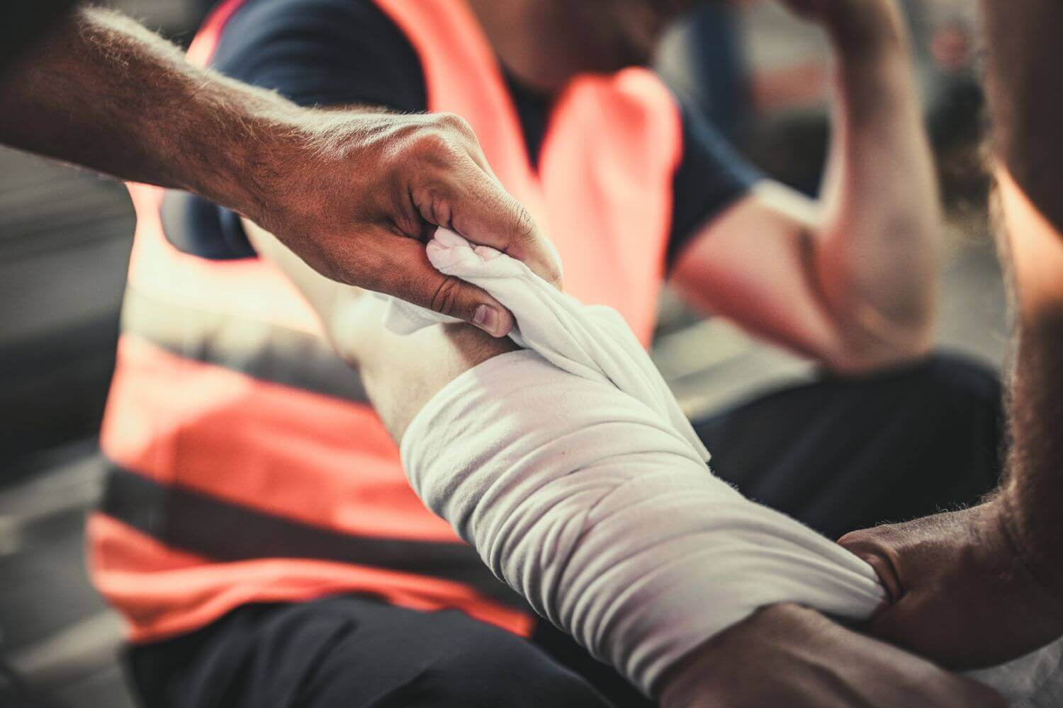 Image of tradesman's arm being bandaged, representing article on employers' liability insurance for tradespeople